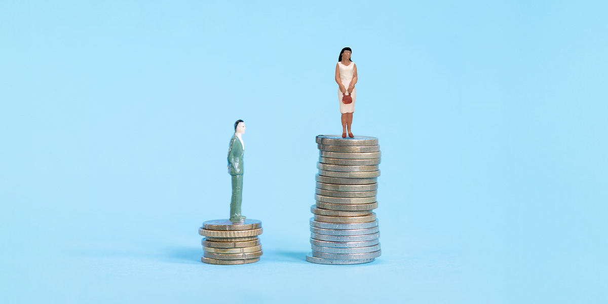 Human figurines standing on stacks of coins